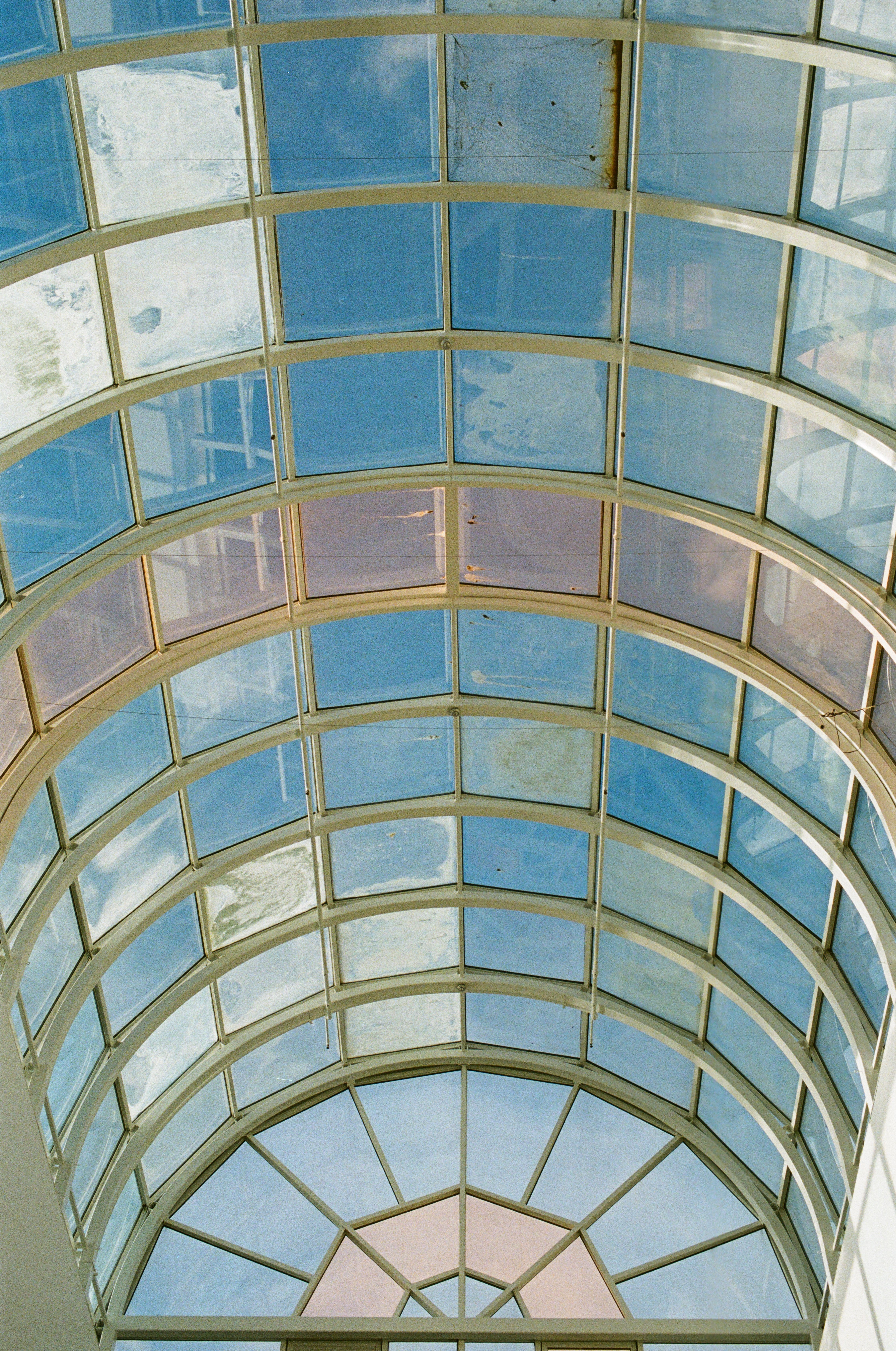 Arched Glass Ceiling with Clear Blue Sky View · Free Stock Photo