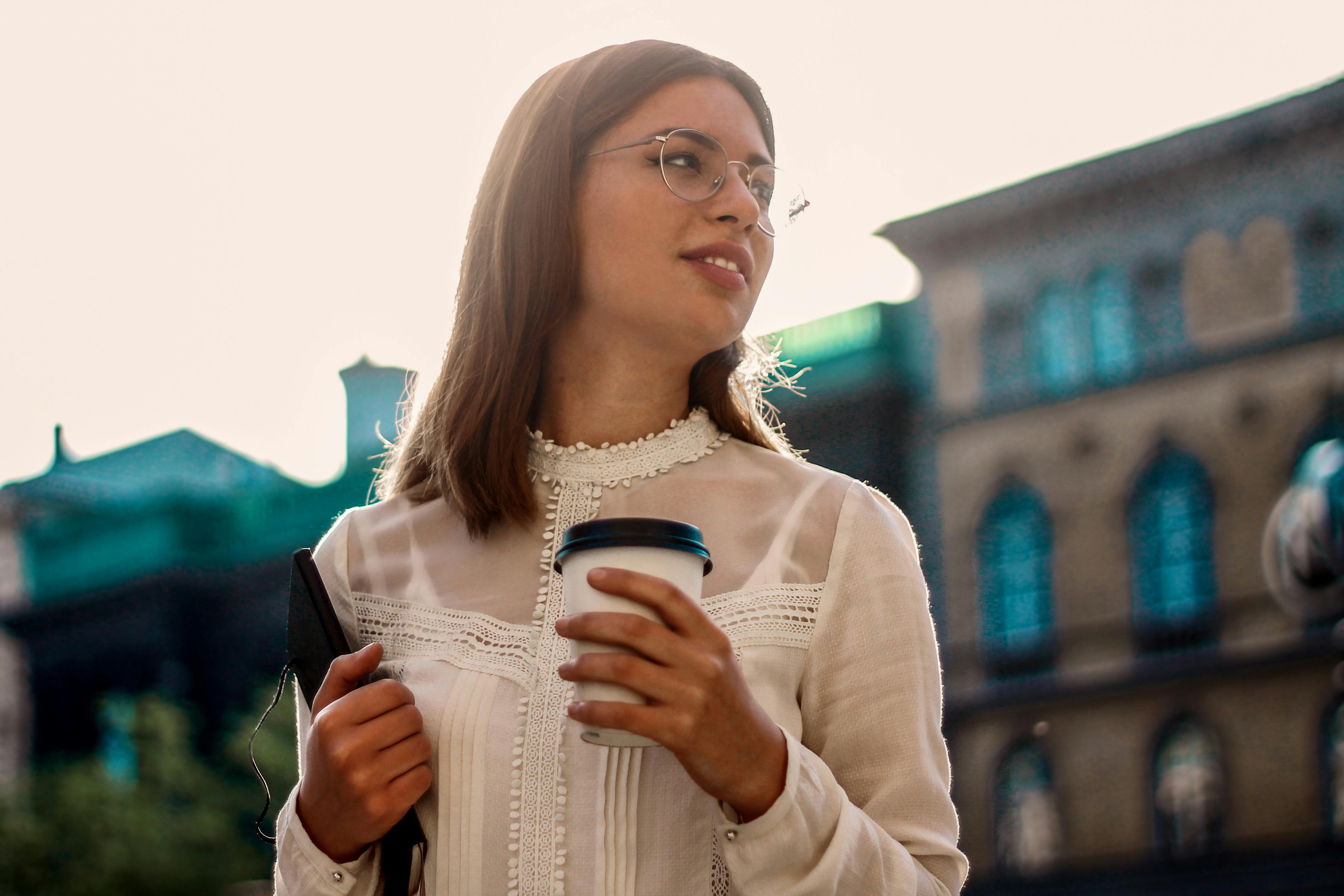 A person playing a video game on a large screen in a cozy, dimly lit room.