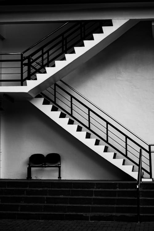 Black and White Staircase With Black Metal Railings
