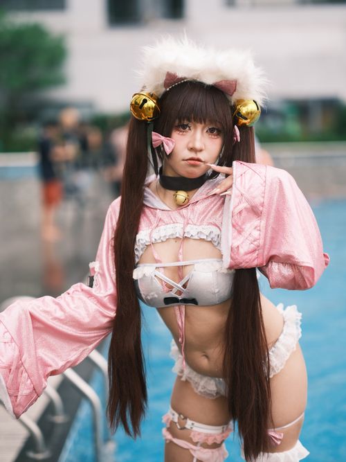 Free Vibrant cosplay photo at a Vietnam event, capturing a woman in pink costume by the pool. Stock Photo