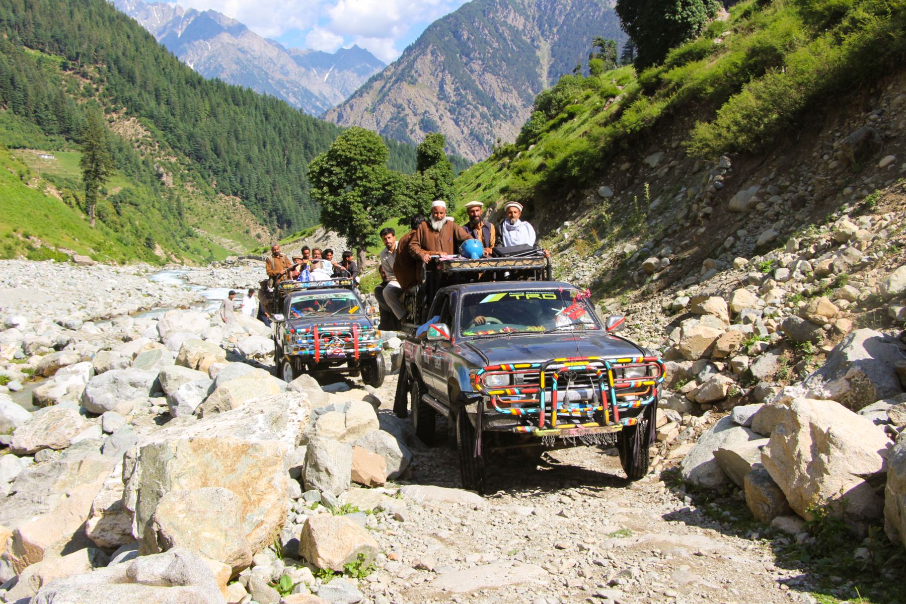 Jeep expedition along a rocky mountain path in Mankyal, Swat Valley, Pakistan.
