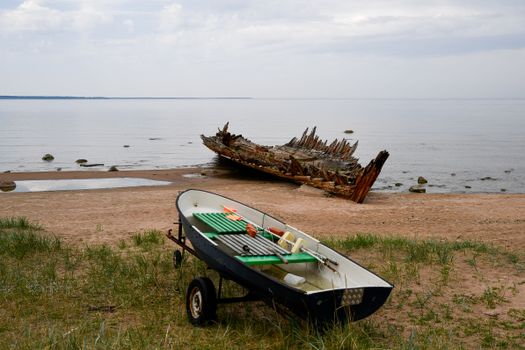 Discover the rustic beauty of an old shipwreck on Loksa Beach in Estonia's serene coastal landscape.