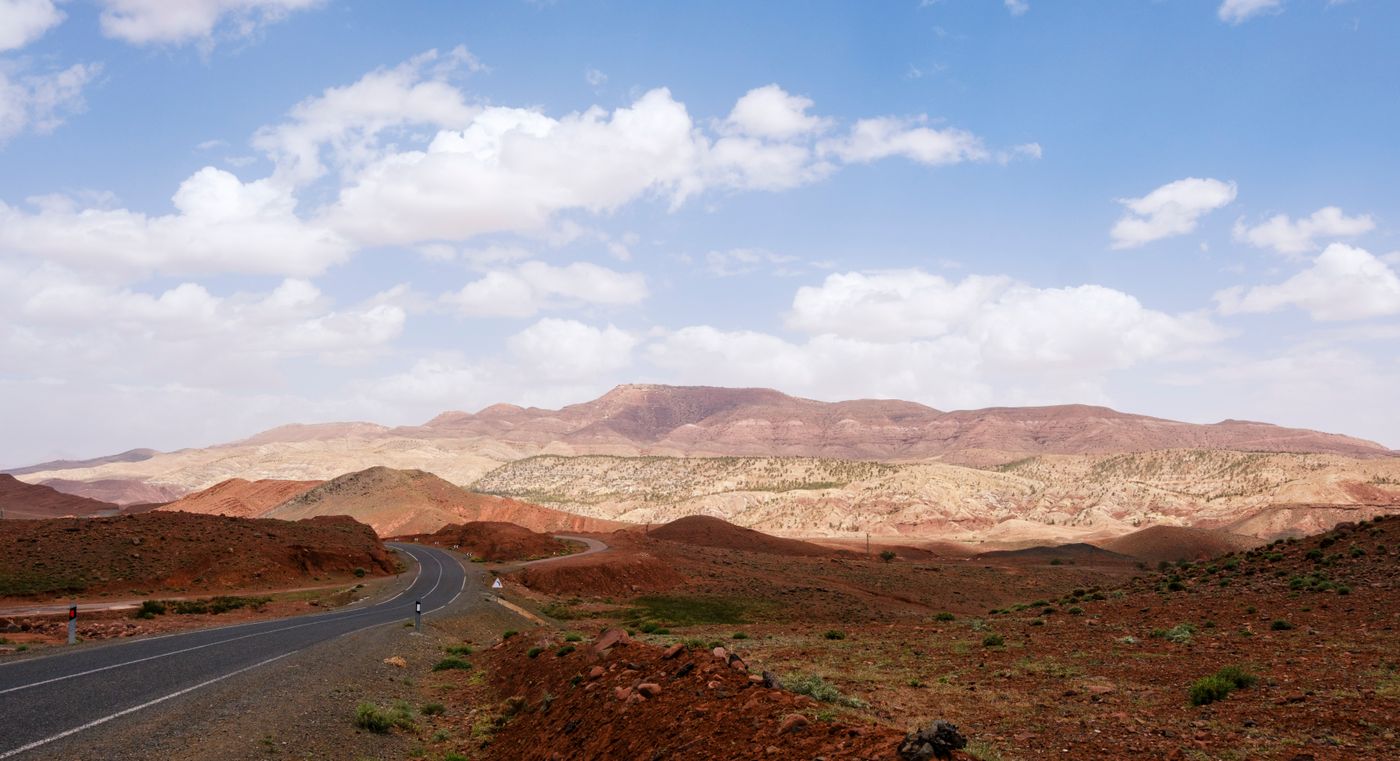 Paved road winding through the rocky Atlas Mountains in Morocco