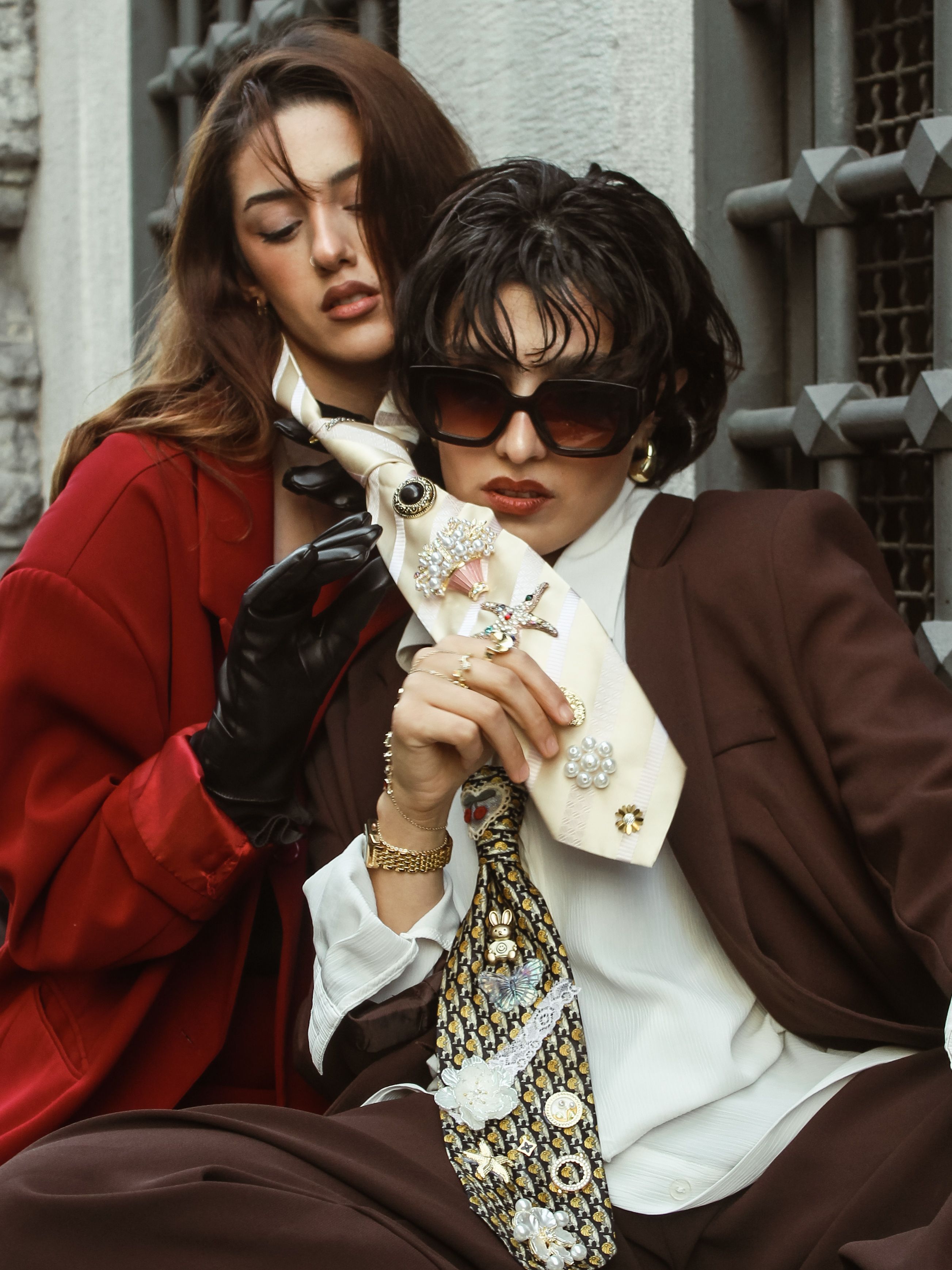 Fashionable Duo in Stylish Suits and Accessory Display · Free Stock Photo