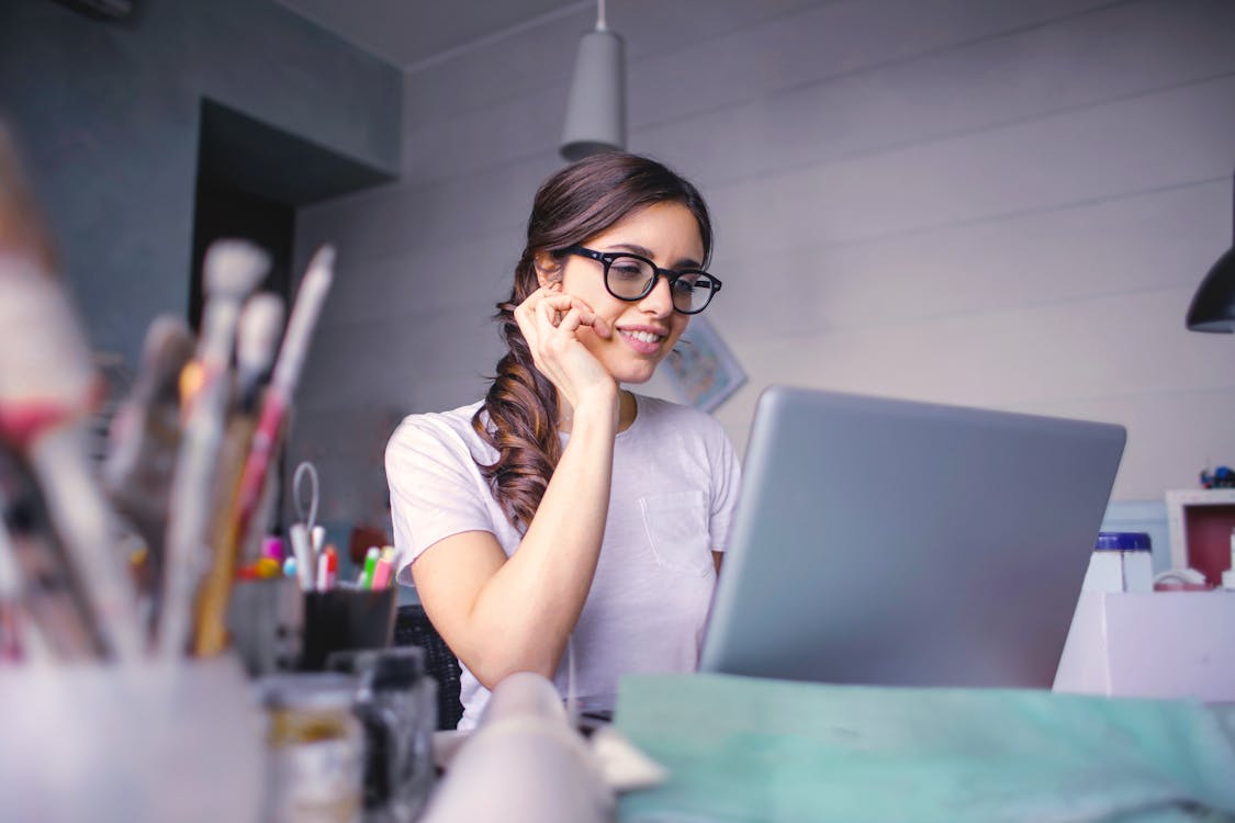 Woman in White T-shirt Wearing Black Framed Eyeglasses