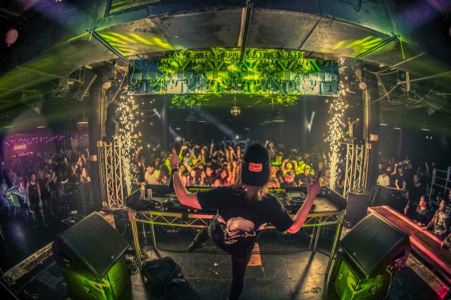 Person skating with city lights behind