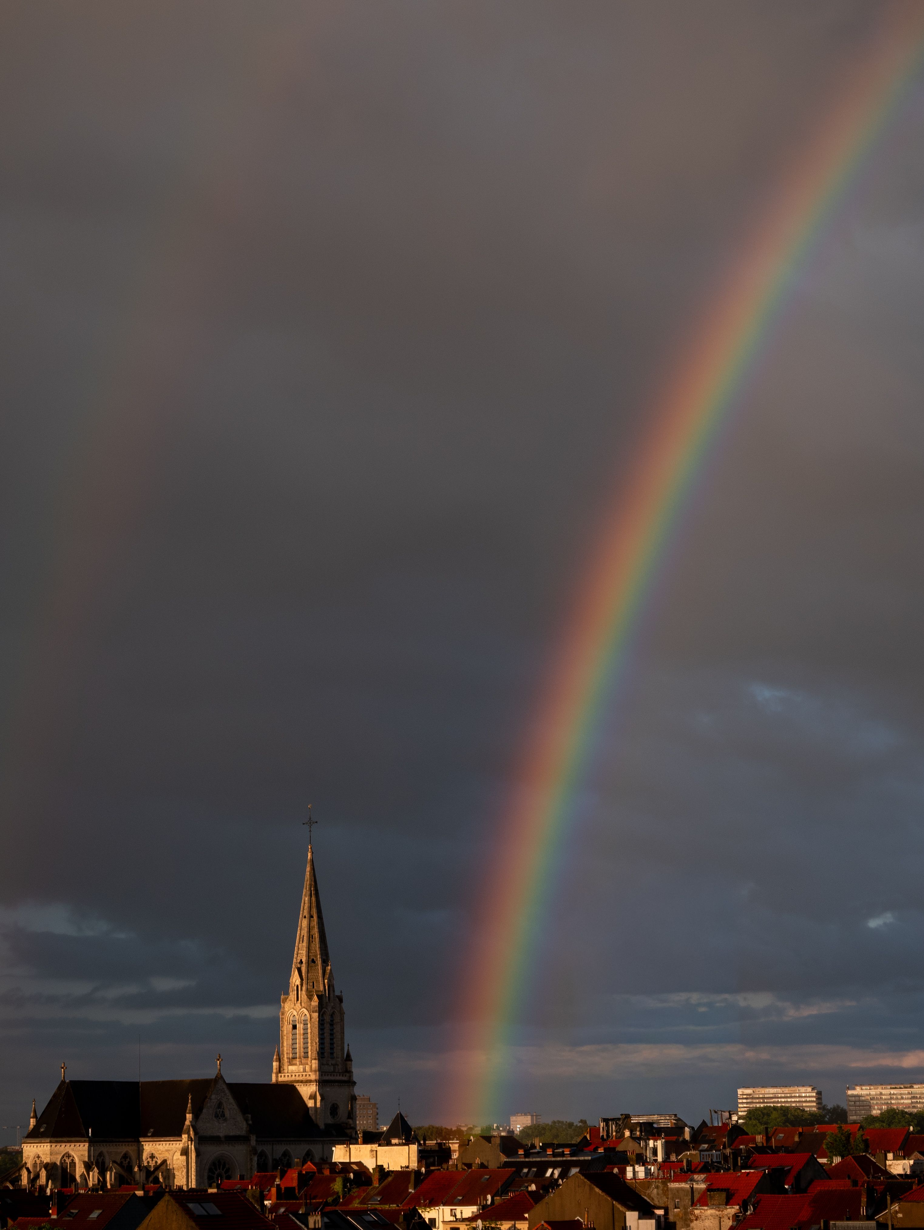 Gothic Cathedral under Vibrant Rainbow in Dramatic Skies · Free Stock Photo