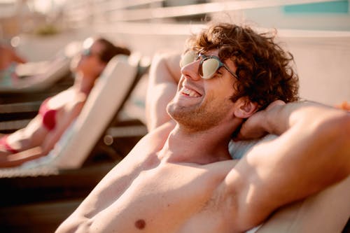 Topless Man Wearing Black Sunglasses