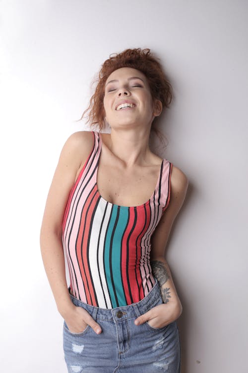 Woman in Stripe Tank Top While Smiling