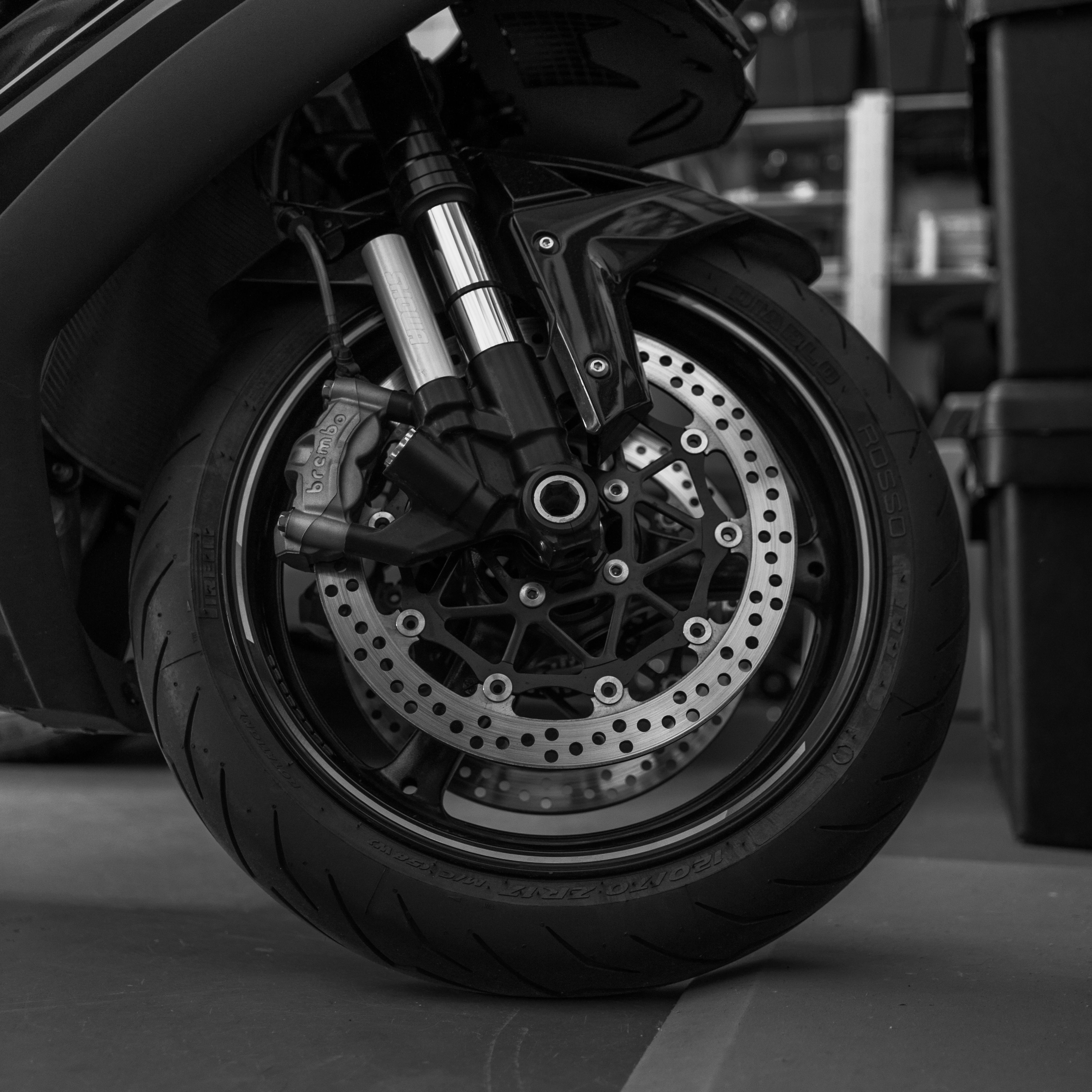 Mechanic's hands fitting a new brake rotor to a wheel hub