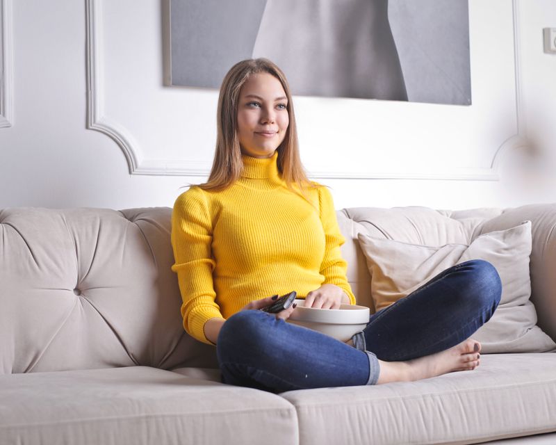 Adult smiling comfortably while resting at home
