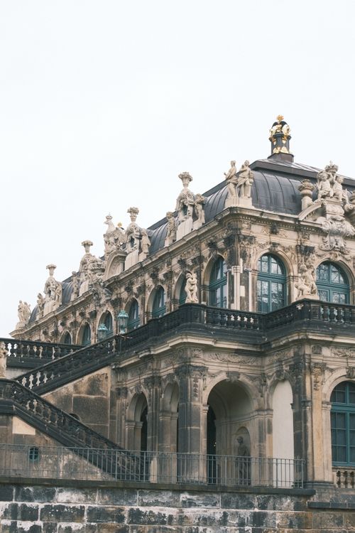 Free Baroque architecture of the Zwinger Palace in Dresden, showcasing its ornate sculptures and historic charm. Stock Photo