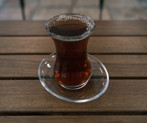 Free Authentic Turkish tea served in a glass, capturing a cozy ambiance. Perfect for cafe promotions. Stock Photo