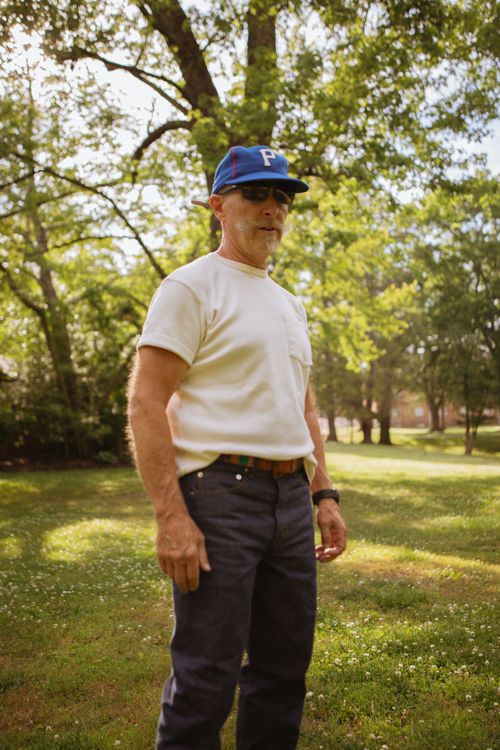 Free Man in casual attire outdoors in Brevard, NC, enjoying a sunny day. Stock Photo