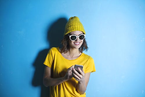 Woman in Yellow Crew Neck T-shirt While Smiling