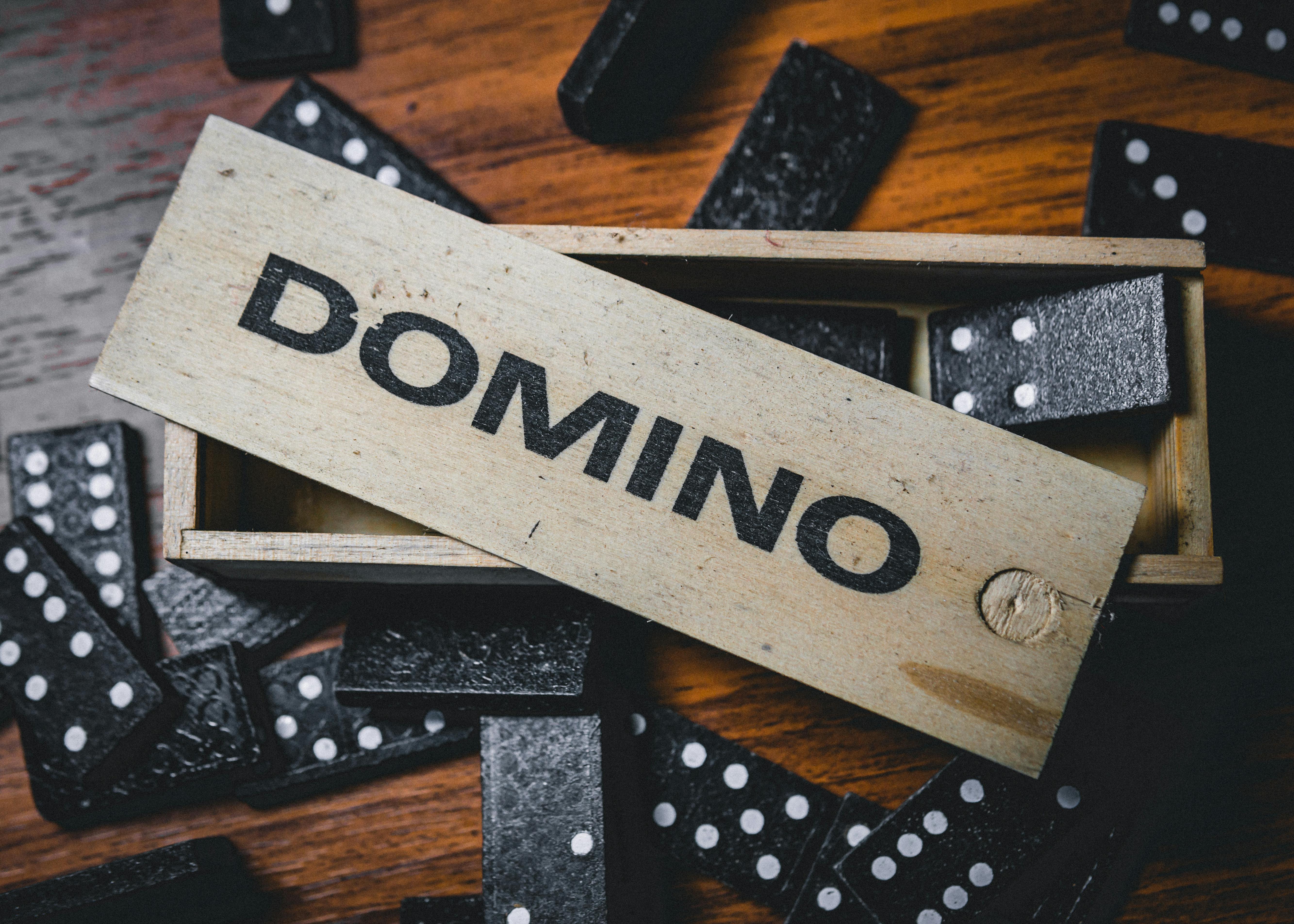Set of domino on wooden table · Free Stock Photo