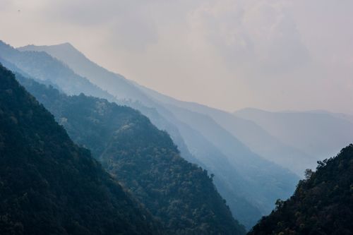 Free Serene misty mountain landscape view captured in Ghandruk, Nepal's Gandaki Province. Stock Photo