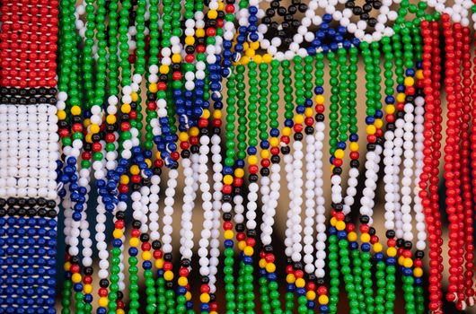 Vibrant close-up of handmade beaded patterns, showcasing cultural craftsmanship. Perfect for design inspiration.