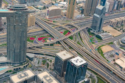 Free High-angle view of modern Dubai's highways and skyscrapers showcasing urban infrastructure. Stock Photo
