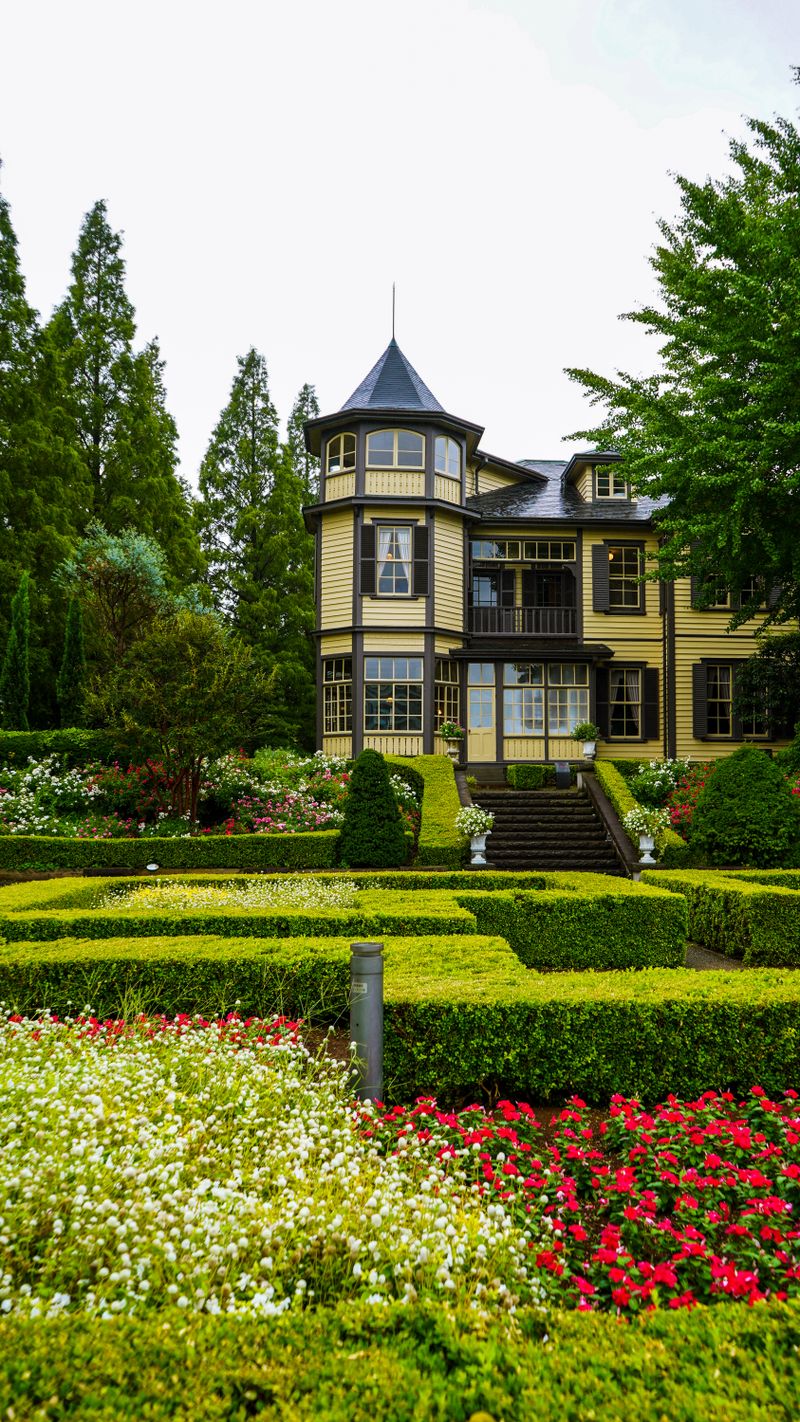 Victorian western residence amid manicured gardens at Glover Garden, Nagasaki