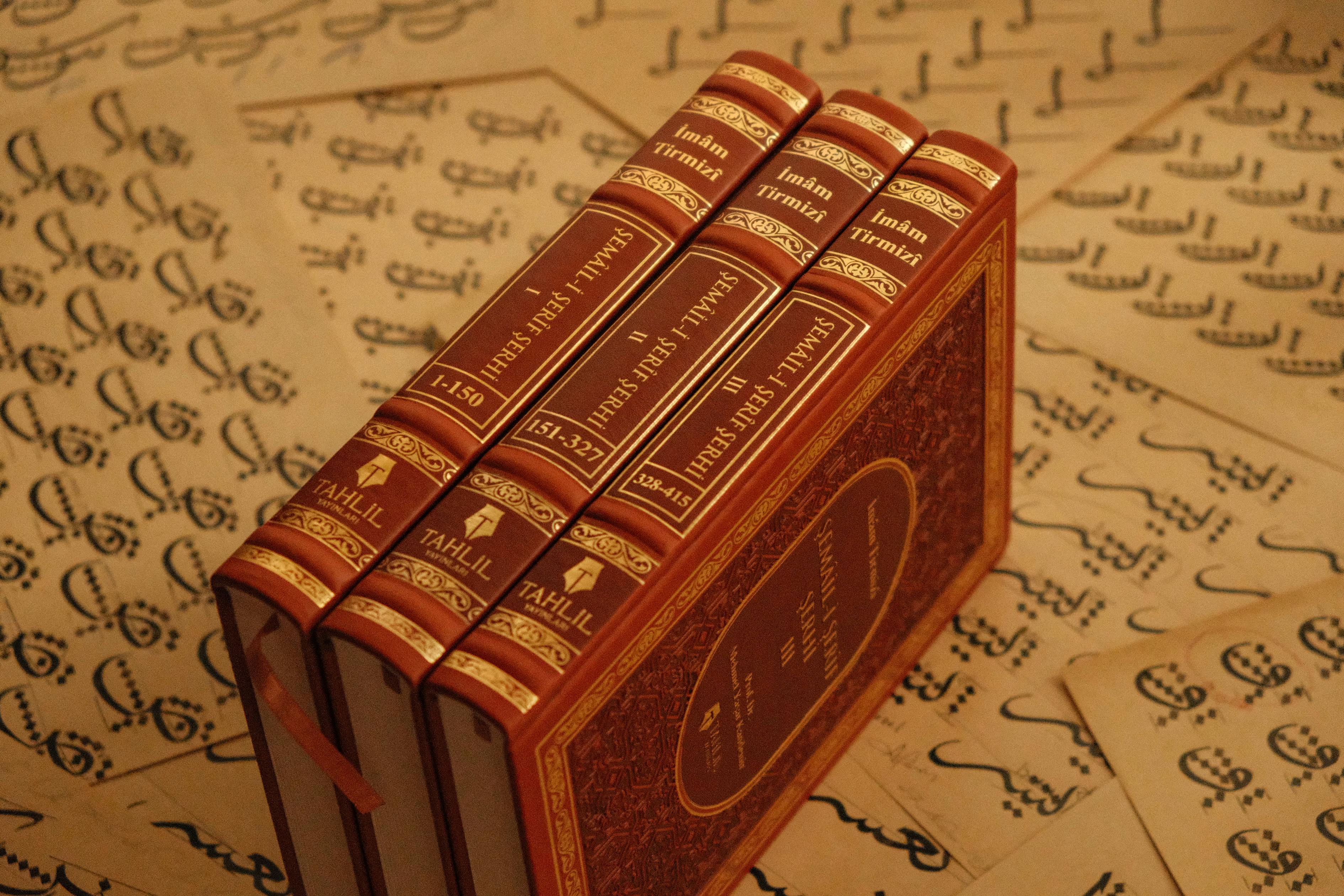 Historic Islamic books on Arabic script, showcasing cultural heritage and traditional calligraphy.