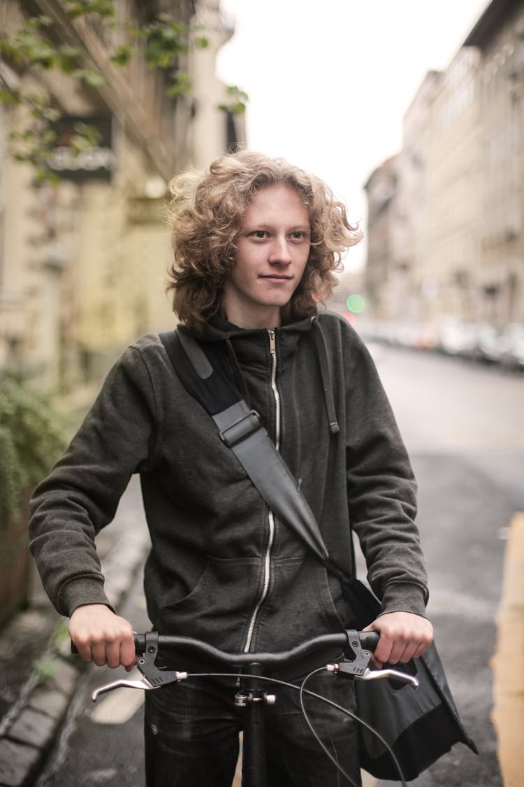 Photo Of A Man Riding Bicycle