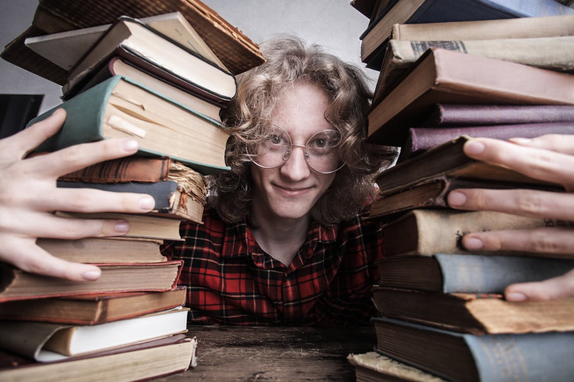 Free A Man Holding His Old Books Stock Photo