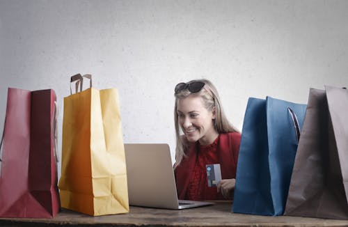 Free Happy woman shopping online at home Stock Photo