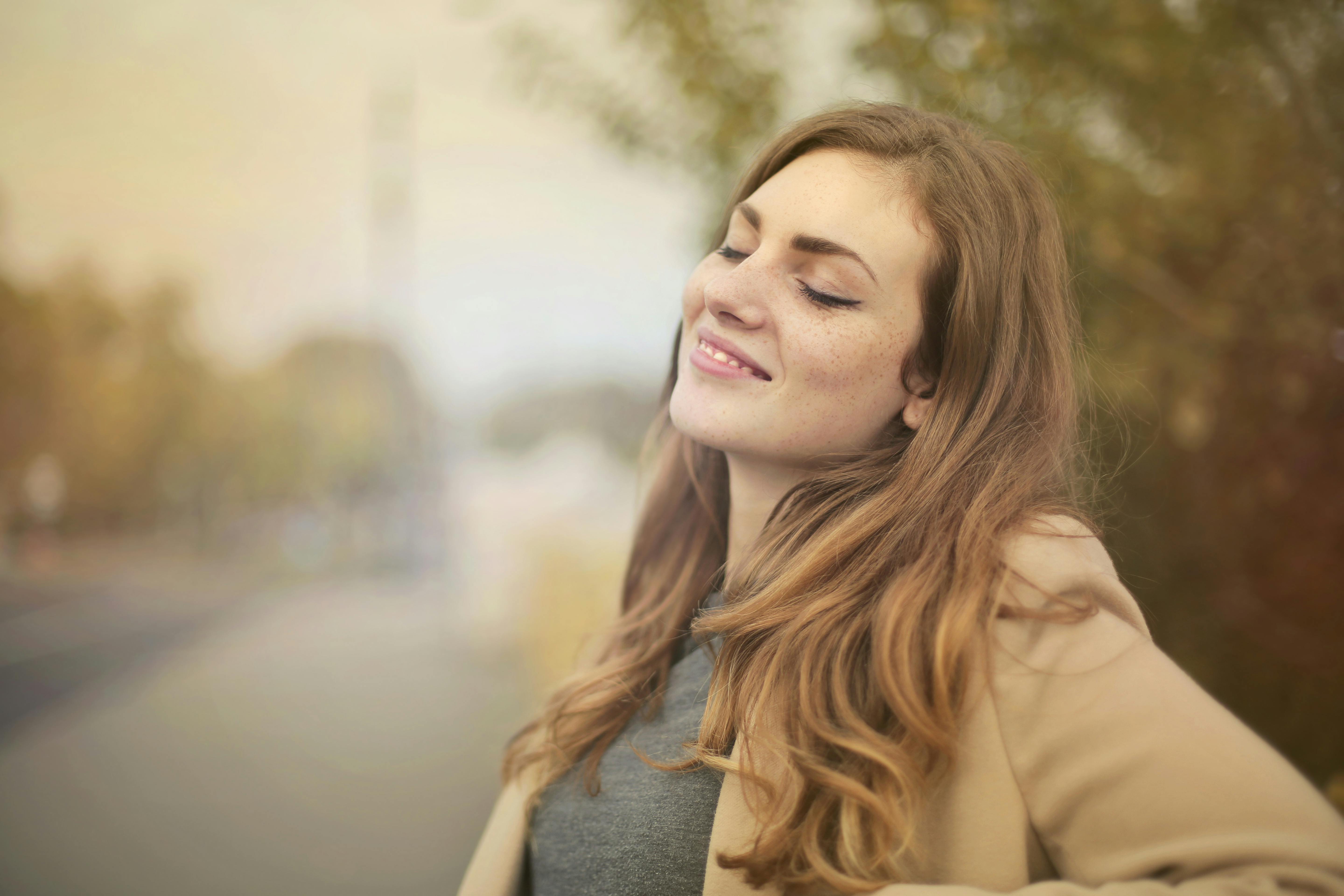 Selective Focus Portrait Photo of Smiling Woman with Her Eyes Closed ...