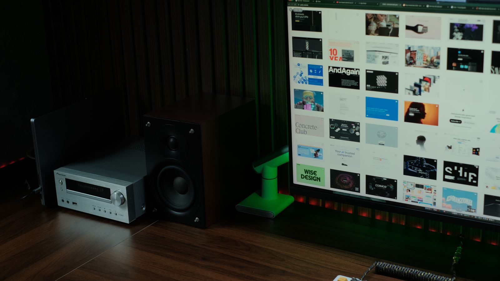 Modern home office with speaker system and audio receiver.