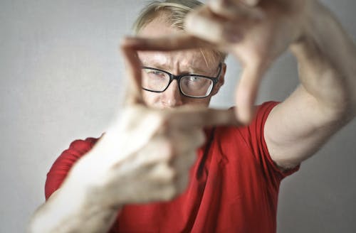 Young man making frame with fingers