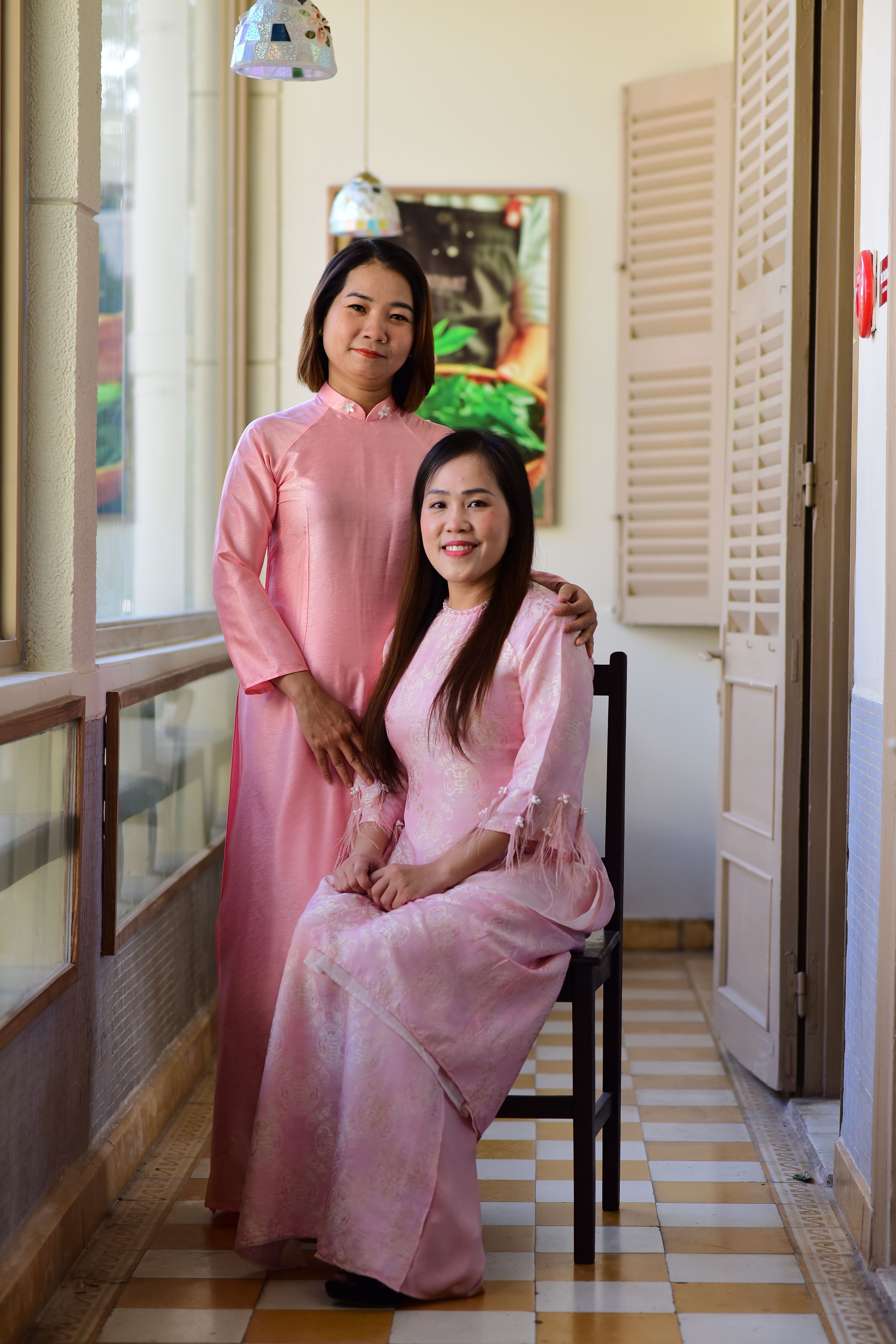 Portrait of Two Women in Traditional Pink Dresses · Free Stock Photo