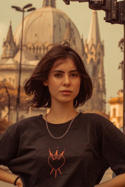 Portrait Photo Woman in Black T-shirt With Her Hands Akimbo