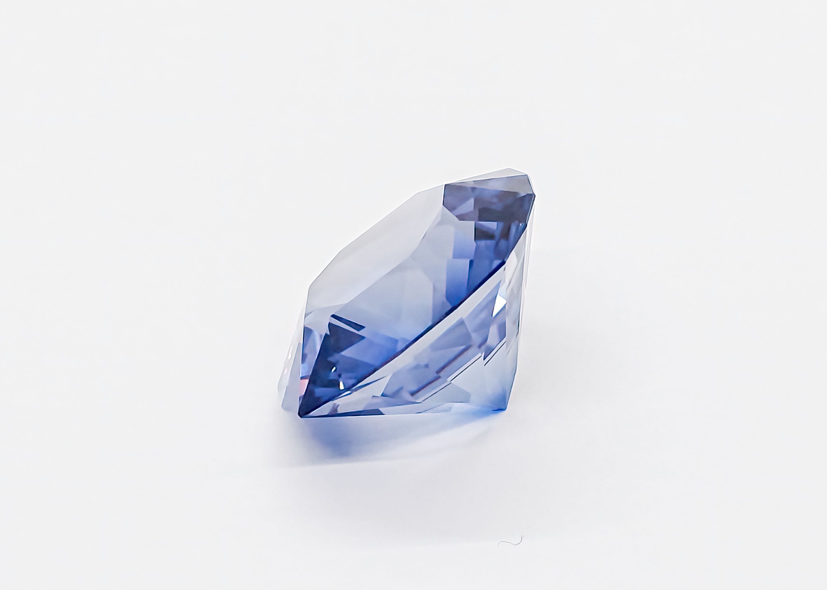Faceted emerald cut London blue topaz gemstone showing step cuts
