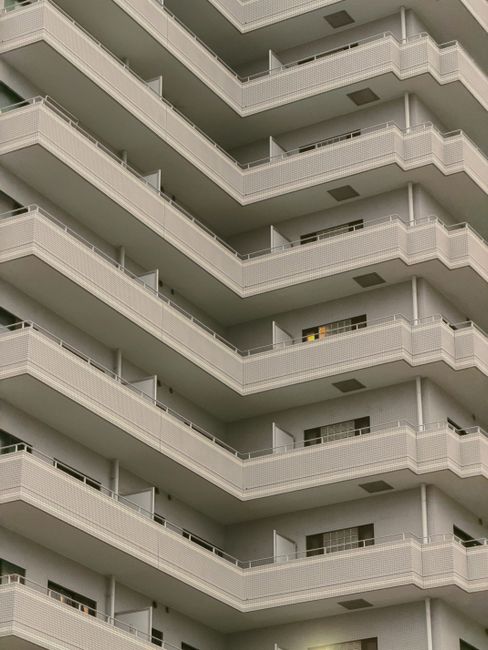 Geometric angles of a modern apartment building in Tokyo captured in soft light.