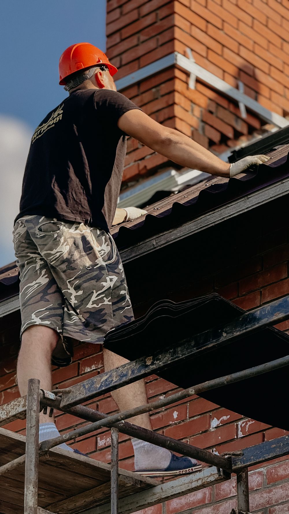 Roofing professional working on a roof