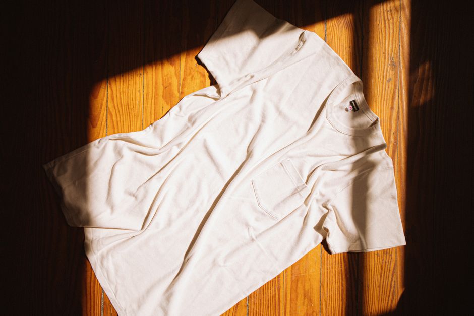 Athletic Works Men's Pocket Tee displayed on a Walmart shelf