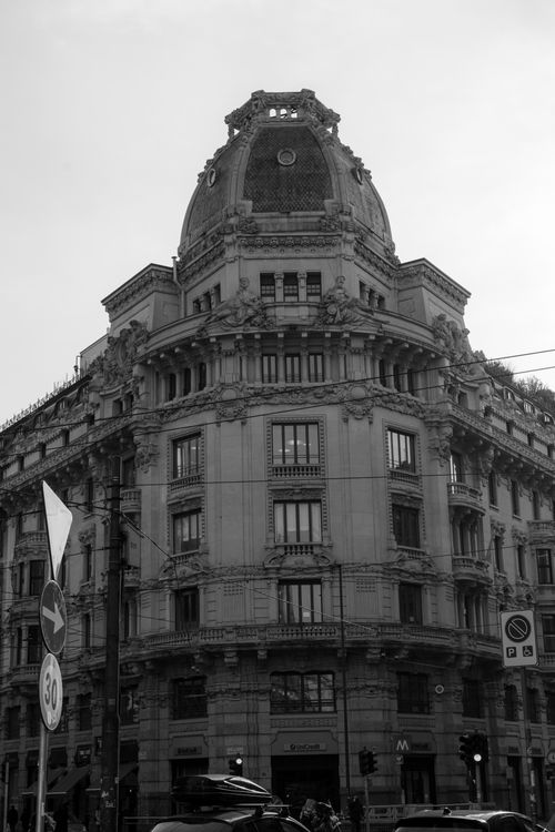 Free Black and white photo of a historic building in Milan's cityscape. Stock Photo