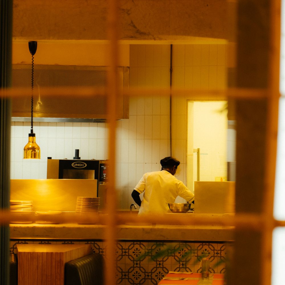 Kitchen Spraying in Oakleigh Park — a decorator at work mid-project