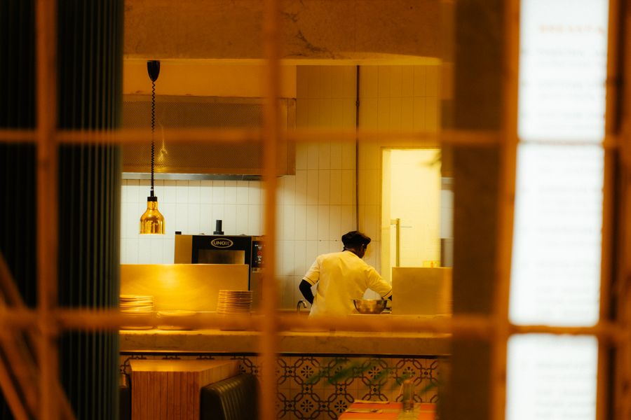 A chef preparing food in the Udaygiri Cantin kitchen