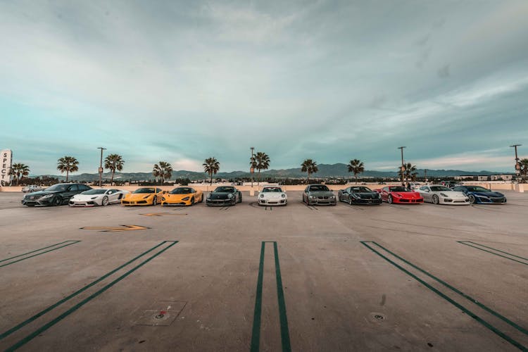 Luxury Cars Parked On Parking Area