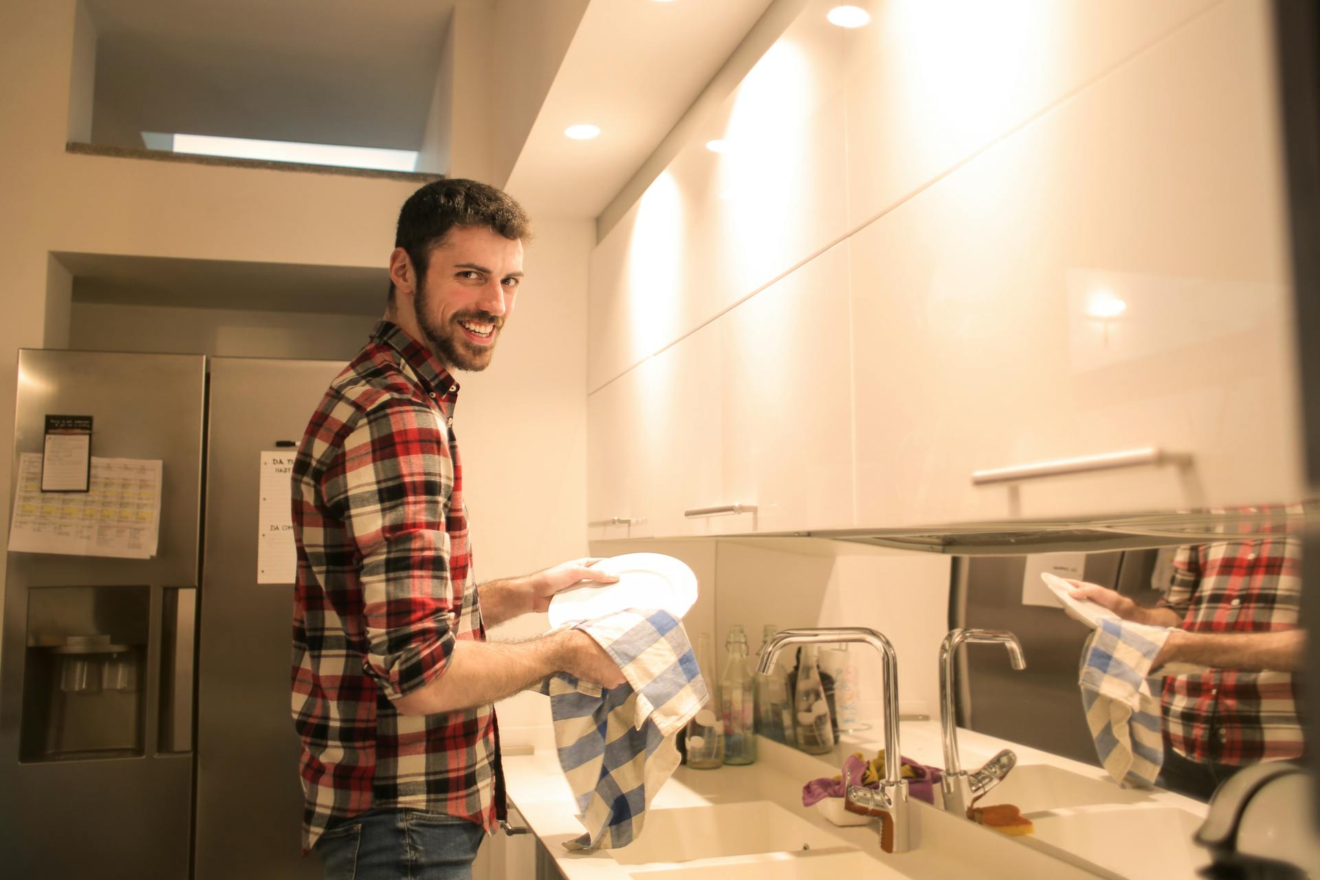 Man Wiping the Dish Plates Clean