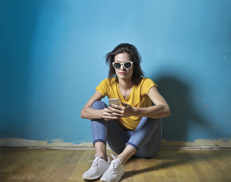 Person sitting quietly in a contemplative moment representing the internal process of grief that unfolds at its own pace regardless of cultural expectations or timelines