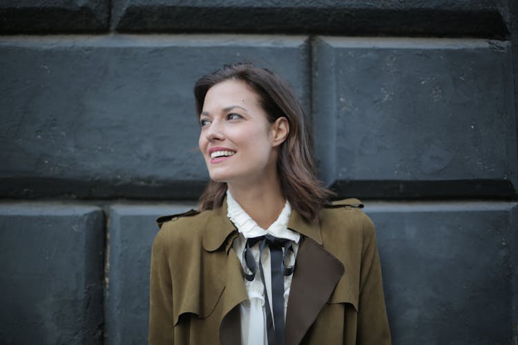 Stylish Cheerful Woman In Coat On Street