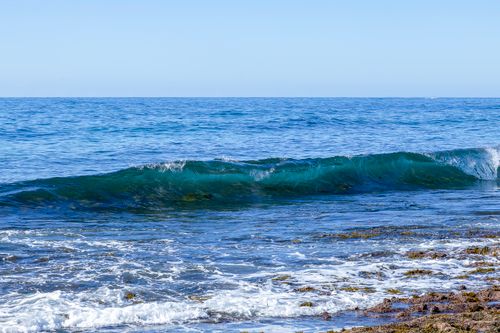 Free Vibrant ocean waves breaking on Culburra Beach, New South Wales, Australia. Stock Photo