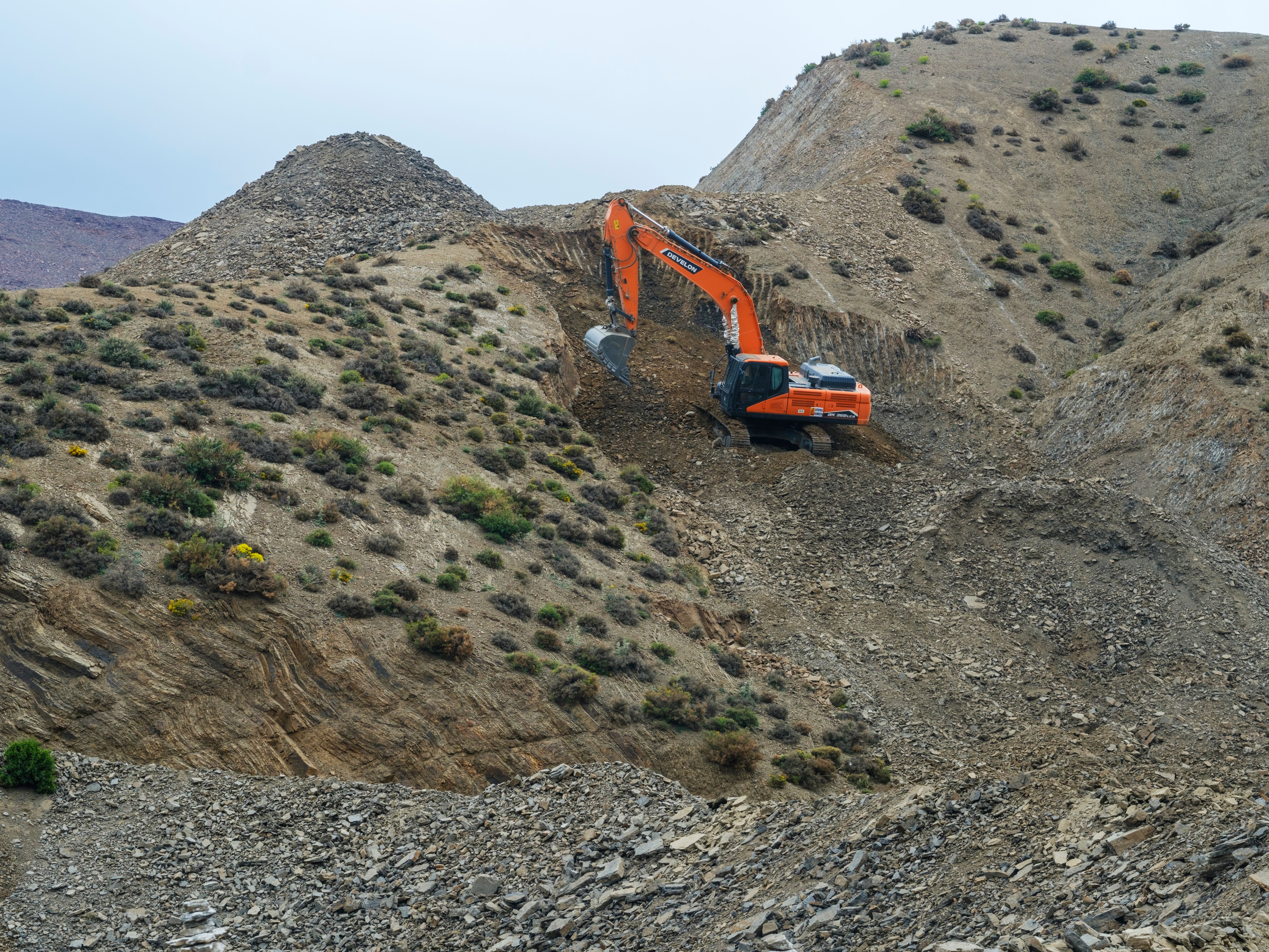 sloped rocky terrain site preparation and grading work