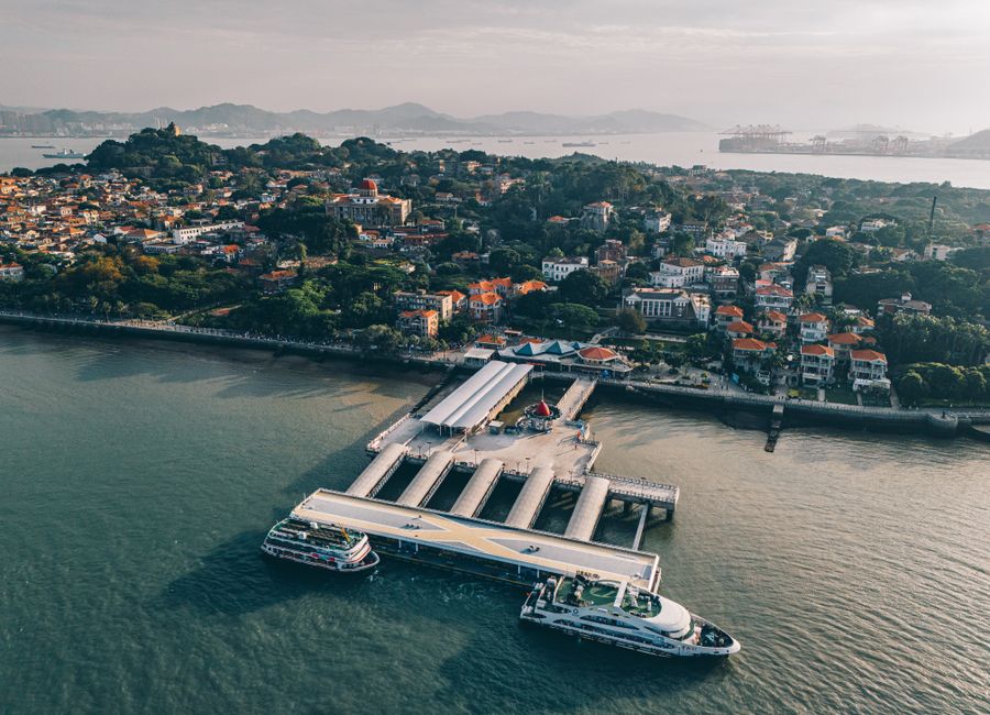 Aerial shot of the Xiamen Port Ferry Terminal and surrounding coastline in China.