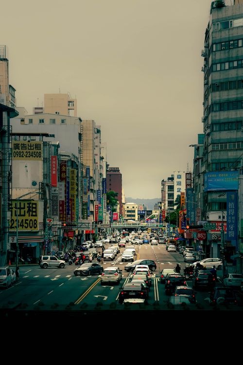 Free Vibrant urban scene depicting busy traffic on a city street in Taiwan, showcasing dynamic city life. Stock Photo