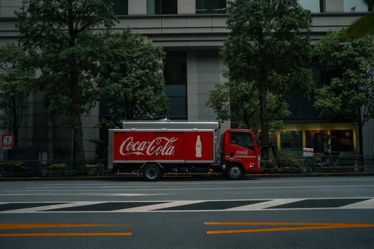 Coca-Cola delivery truck parked on a street in Tokyo, Japan.