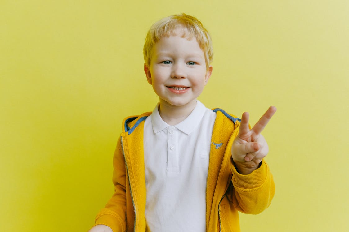 Free Boy in Yellow Zip Up Jacket Stock Photo